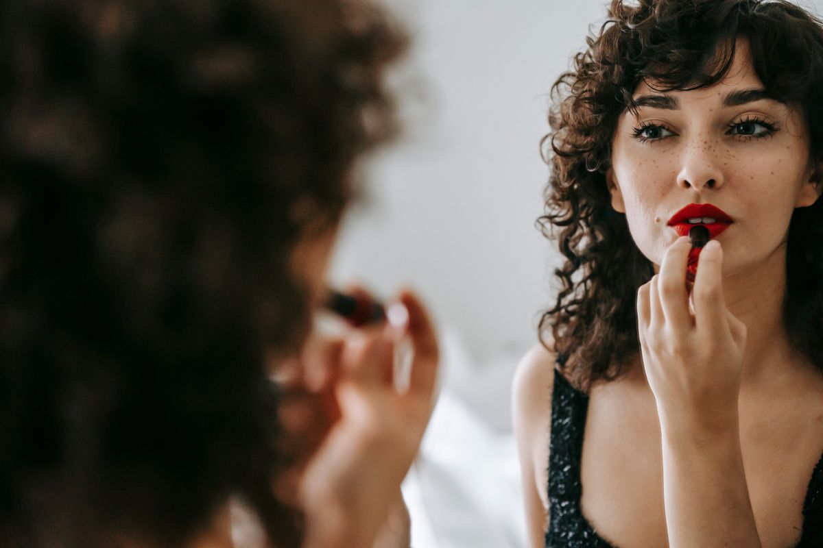 Makeup artist finishing a client's look
